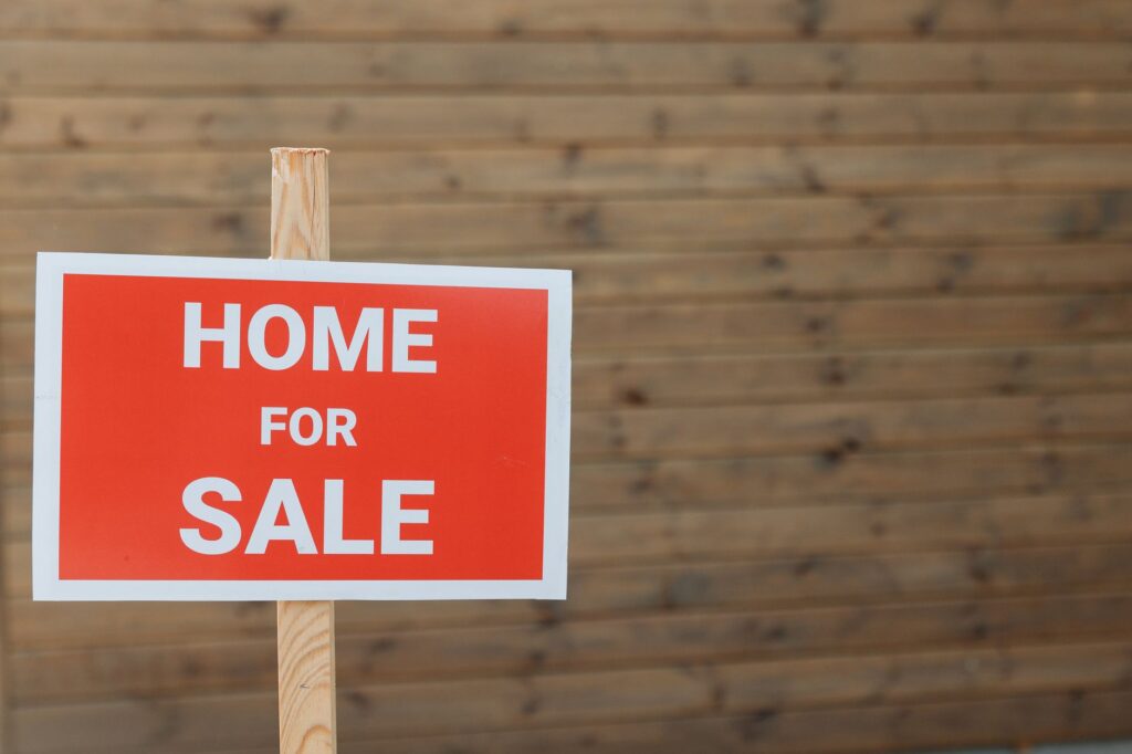 Professional real estate agent presenting modern residential property to potential buyers at open house